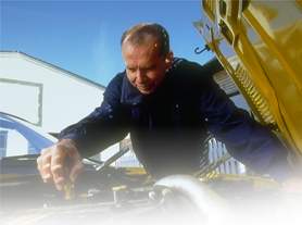 [photo of jim tuning his car]