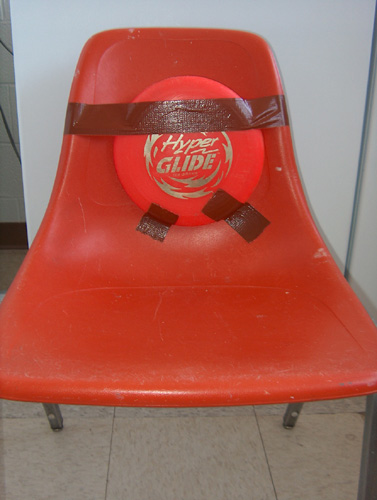 Hyper Glide Frisbee Taped to Chair
