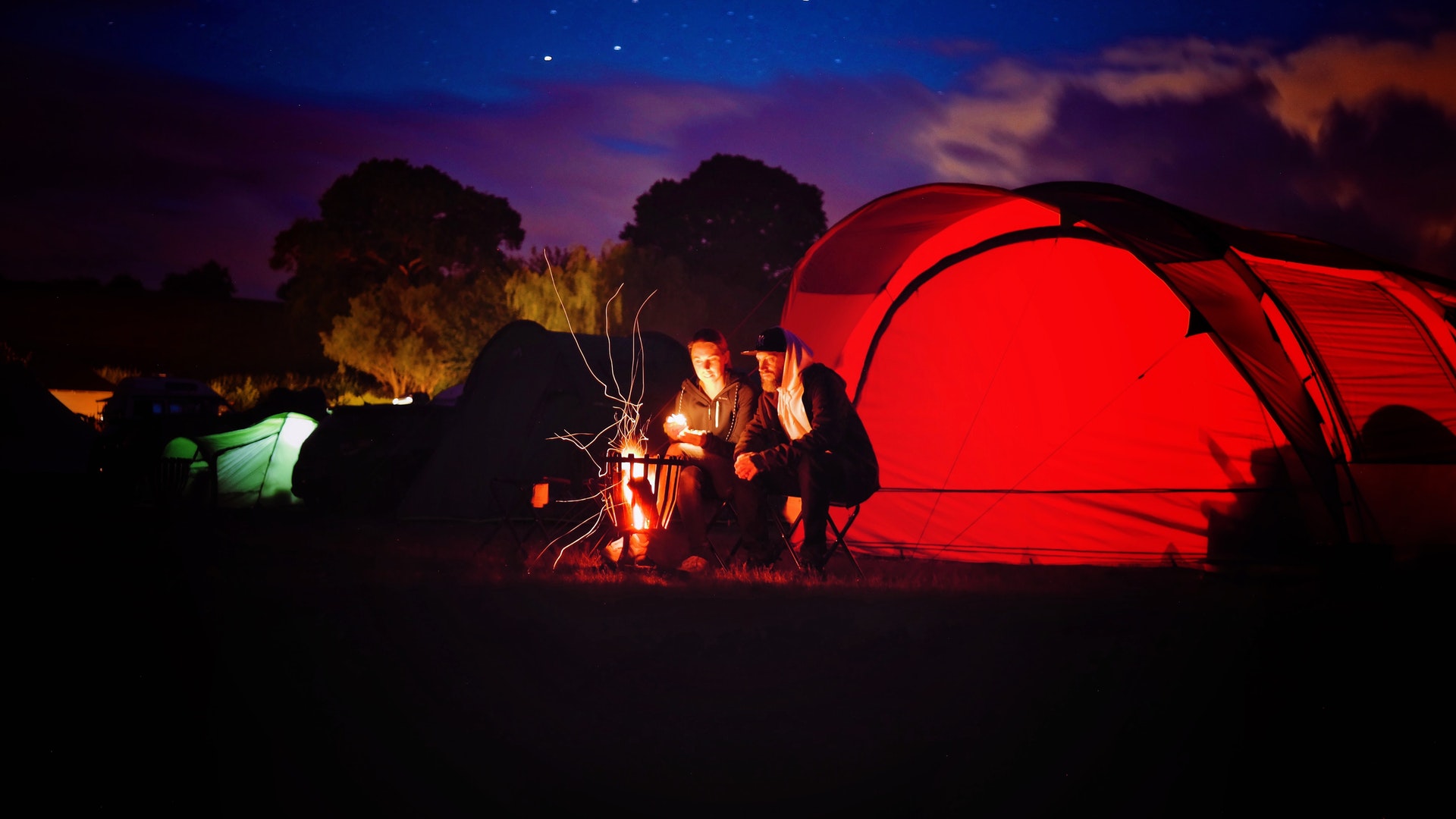 Couple Around a Campfire
