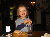 Liam have TONS of fun in a cafe at the Medieval Village we visited in Oct. 05.