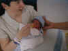 First feeding of Nate by Jocie  (57240 bytes)