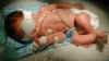 Hopefully last day of photo/light therapy for Nate - Jaundice levels are down!  =)  (49274 bytes)