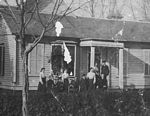Cropped version � Laura Nickel and F.I.S. with family group in front of house, probably Blandinsville, Illinois
