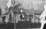 Laura Nickel and F.I.S. with family group in front of house, probably Blandinsville, Illinois