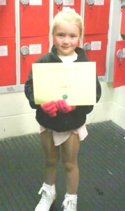 Courtney Miller Receives her Grade 1certificate