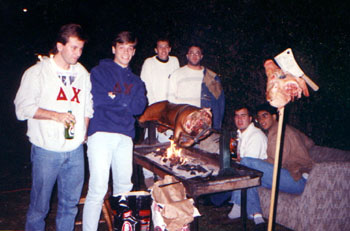[Tim, Mike, Marty, Lou, Matt & Ajay watching the pig roast]