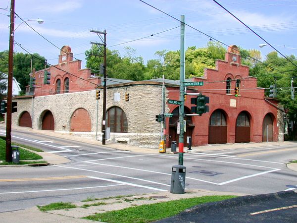 Cable car barn at the corner of Highland and Dorchester Avenues in Mt. Auburn, looking northwest. The stone section is from the original carbarn that burned down in 1892. The brick parts were built after the fire. This building was used by the Mt. Auburn Cable Railway, which operated cable cars along Highland Avenue to downtown from 1887 to 1902.