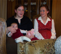 Emmie (held), Rebecca, and Alison