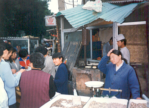 Bakery. Real life in the hutongs (neighbourhoods) of Beijing. Two seconds after this shot was taken, the woman to the right gave me a rather dirty look.