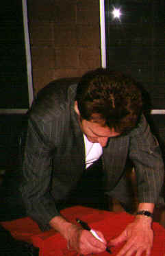 John signing my t-shirt