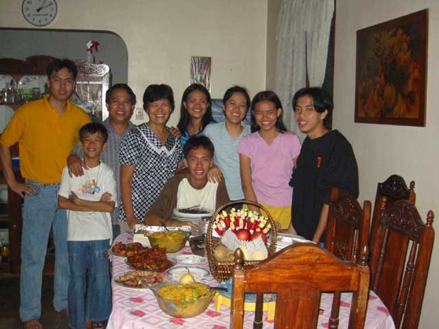 Eldest and Youngest side by side, Ma and Pa sweet as ever, Sisters next to each other, Boys guarding front and back.