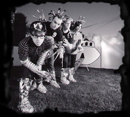 Weezer wearing what looks like tinfoil around their feet and in their hair! NOW I am worried!