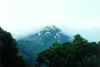 The mountain revealing its snow-capped peak