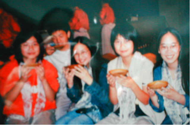 Jinjin, Elisha, Jinyin, and I, holding our plate-cups of wine; we gave ours to the guy sitting behind JinYin and Elisha