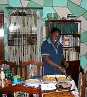 Ms. Lewis serving Christmas dinner