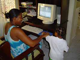 Julia and baby Michalia on the computer