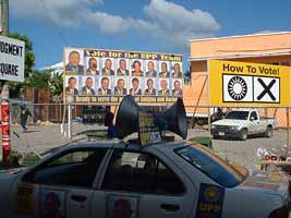 UPP car in front of Judgement Square billboards