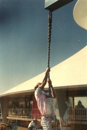 Sam climbing a rope.