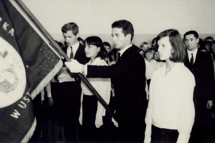 In the Background the School Director Mr. Bronisław Piekarski- Mr. Piekarski, from the other side of the Atlantic Ocean I wish to thank you. Thank you for just being a human. At the time that all the local communist world was against my father and against my family.  You gave us sisters and me my brother no political discrimination. You helped us to graduate. Thank you for all the nights I spent sleeping in school, because the school activities were longer, I do remember the extra dinner, or extra money too.  We know you were pressured, but you didn&rsquo;t give up your human face for the Communists