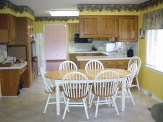 Kitchen and eating area with dining room beyond