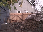 New Woodpile, Fence & House