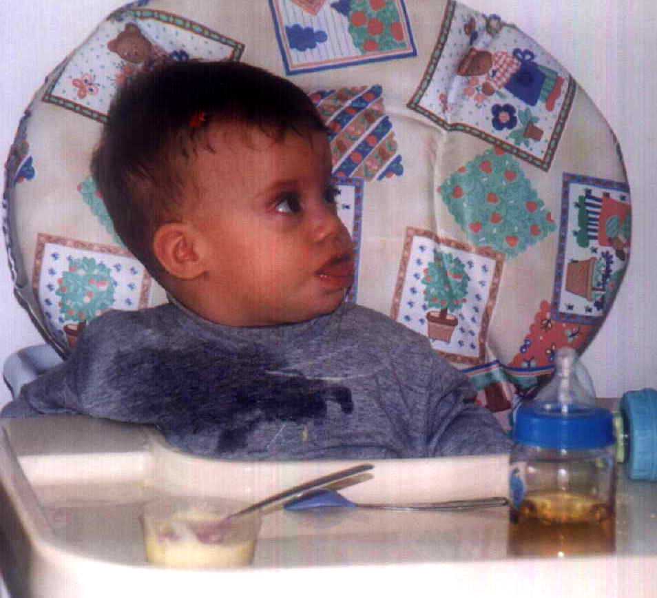 Brit eating bananas in her new high chair