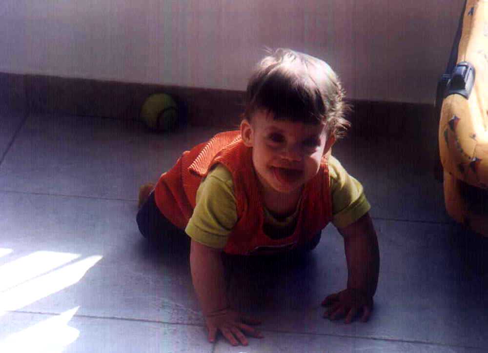 Brit in her orange dress on the floor