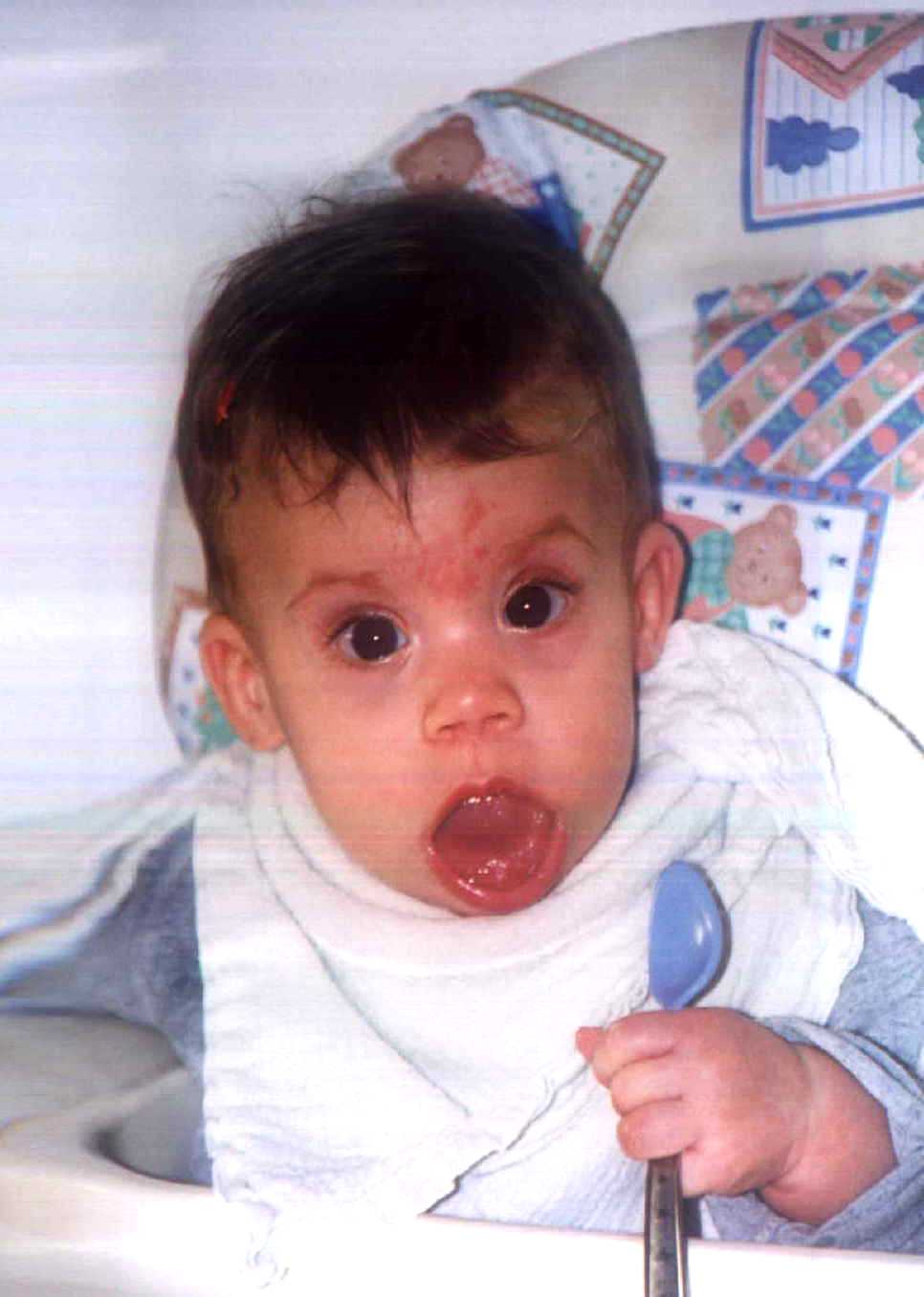 Brit looking dazed and confused about this 'high chair' concept