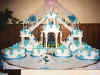 Aqua frosting flowers on all cakes with fountain