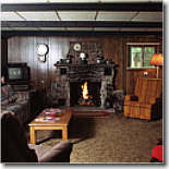 Butler's Bungalow has a carpeted living room, equipped with a TV, VCR, gas fireplace, and an excellent view