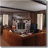 Large living room that includes a TV, VCR, stereo, fireplace, and scenic view