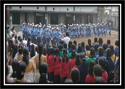 A group of people in uniform marching in front of a building

Description automatically generated