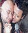 Richard plants a kiss on Paul who blushes
