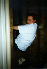 Elissa Climbing Out of Window