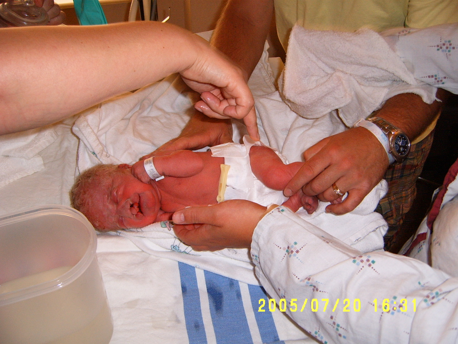 Putting on Kalysta's first diaper!