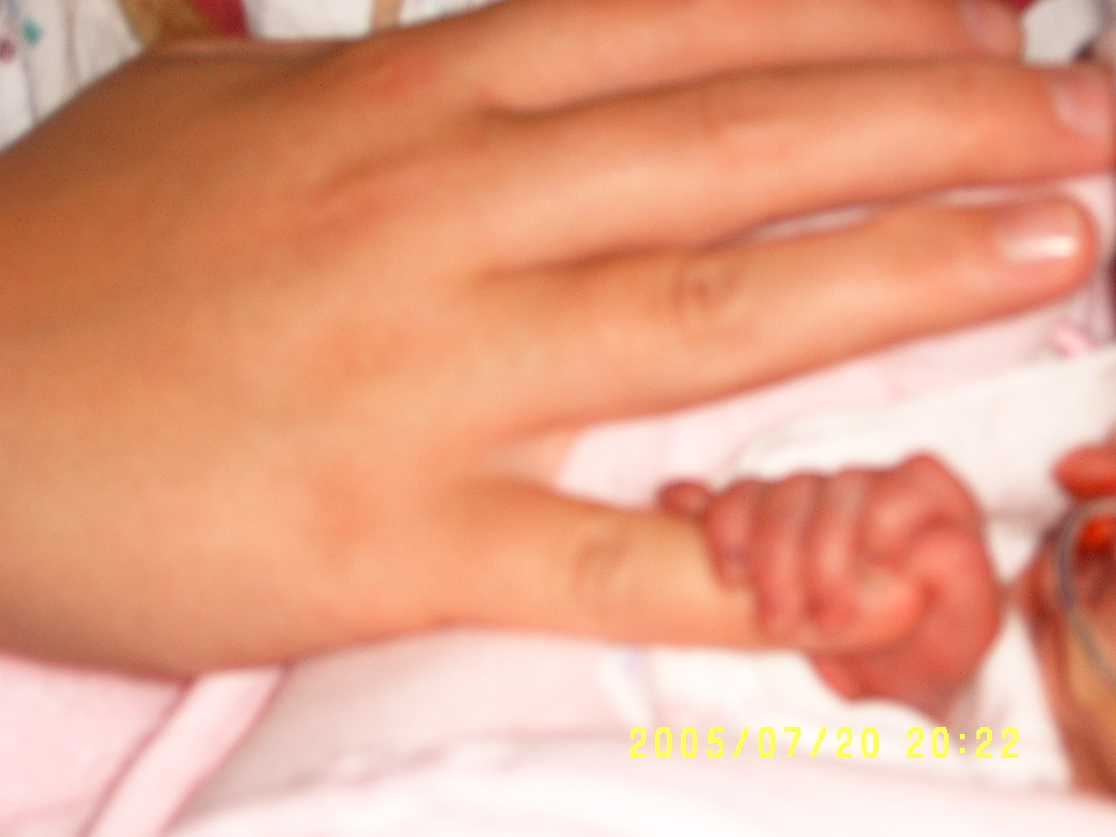 Kalysta holding mommy's hand
