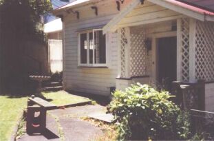 Front dooor and yard (with birdbath)