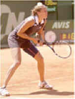 Jana waits to receive serve