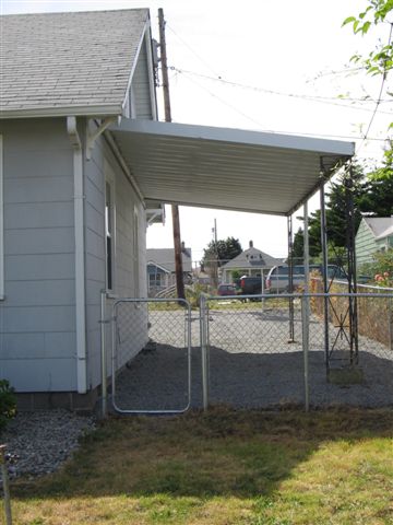 This will eventually be removed and a garage built right next to the alley.