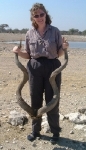 Still at Etosha... Karen giving some scale/perspective for some old kudu horns.    CLICK HERE FOR A LARGER VERSION OF THIS PHOTO.