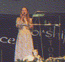 Click to see larger. Kathleen singing at Christmas