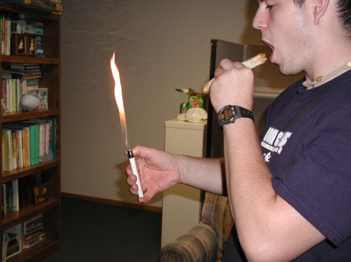 Adam pretending to smoke a taquito at guys night...