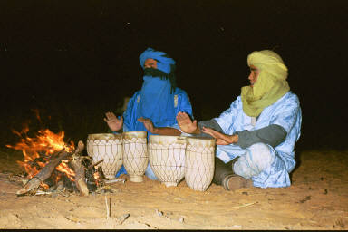 Serenading the foreigners after feeding them tajine in the desert