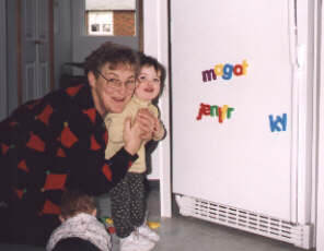 Genevi�ve with Grand-Maman after spelling her aunt Jennifer's name on the fridge