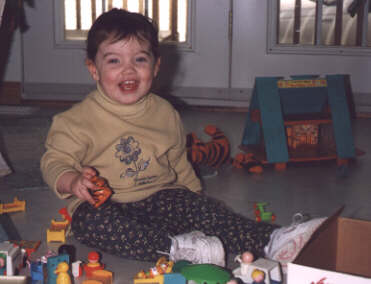 Genevi�ve playing with her toys