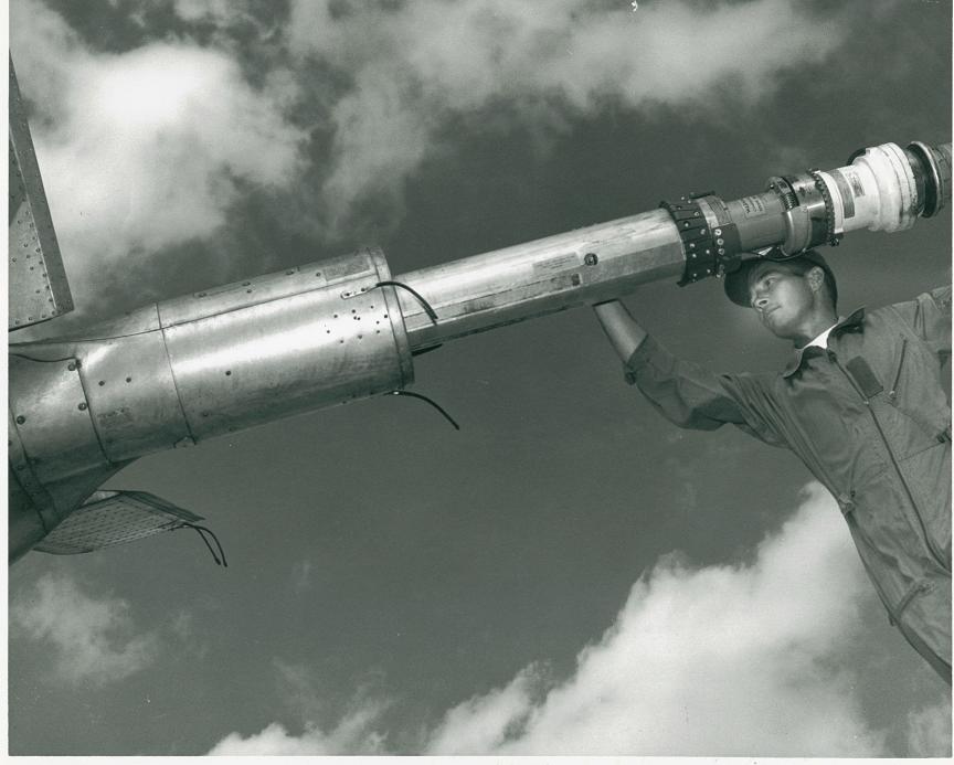 22nd AREFS KC-97 boom operator checking on signal coil.