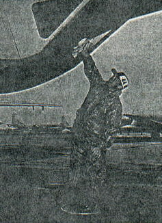 To make certain that he will have an unobstructed view of approaching bombers in flight, SSgt Comeaus, 44th AREFS boom operator, cleans his sighting window at rear of plane before a training mission. He is standing on a stool to reach. March 1961.