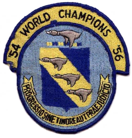 11th Bombardment Wing patch. EMBLEM: Azure, on a bend or, three grey geese volant proper. CREST: On a wreath or and azure a grey goose proper with wings displayed and inverted. MOTTO: PROGESSIO SINE TIMORE AUT PRAEJUDICIO- Progress without fear or prejudice. Approved for 11th Group on 11 Jun 1941 and for 11th Wing on 3 Aug 1956.