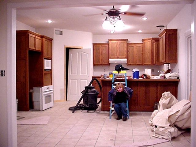 Kitchen Cabinets through the Great Room's doorway. -Construction