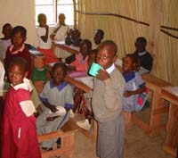 Children eating the porridge provided by the School